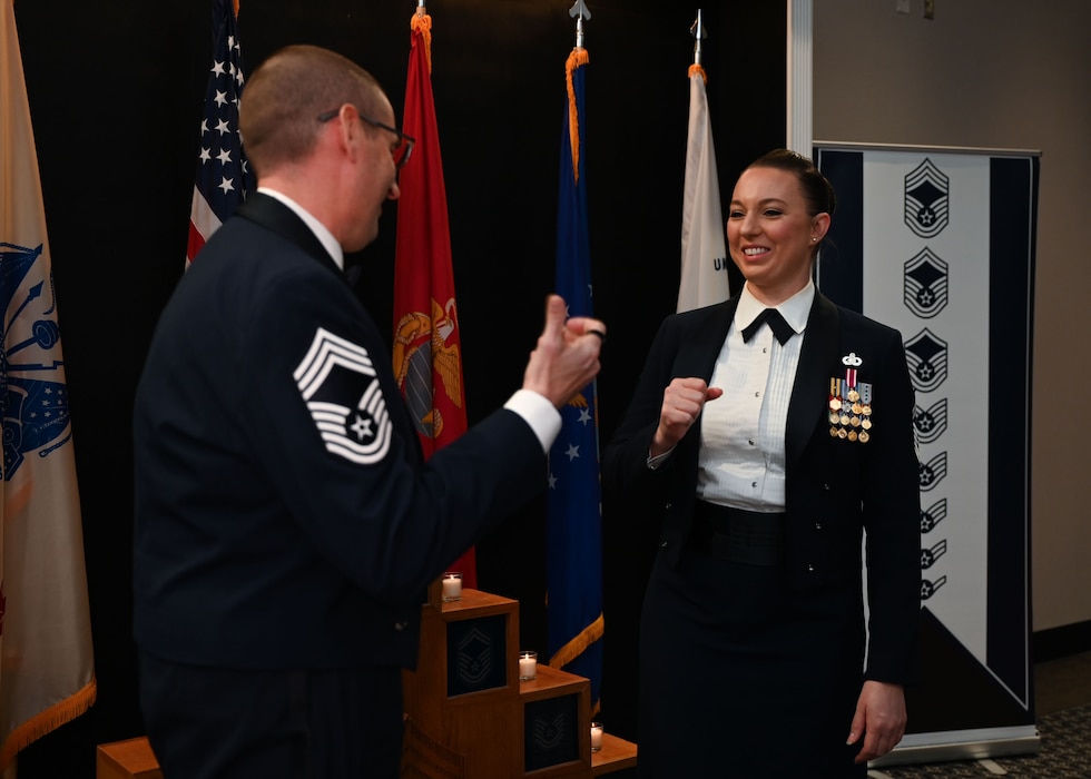 U.S. Air Force Chief Master Sgt. Brandon Abbott, 17th Training Group senior enlisted leader, left, and Chief Master Sgt. select Jessica Thompson, 17th Force Support Squadron senior enlisted leader, congratulate each other at the 2025 Chief Recognition Ceremony in the Powell Event Center at Goodfellow Air Force Base, Texas, March 14, 2025. Both Abbott and Thompson began their Air Force careers in June 2006. (U.S. Air Force photo by Senior Airman Evelyn J. D’Errico)