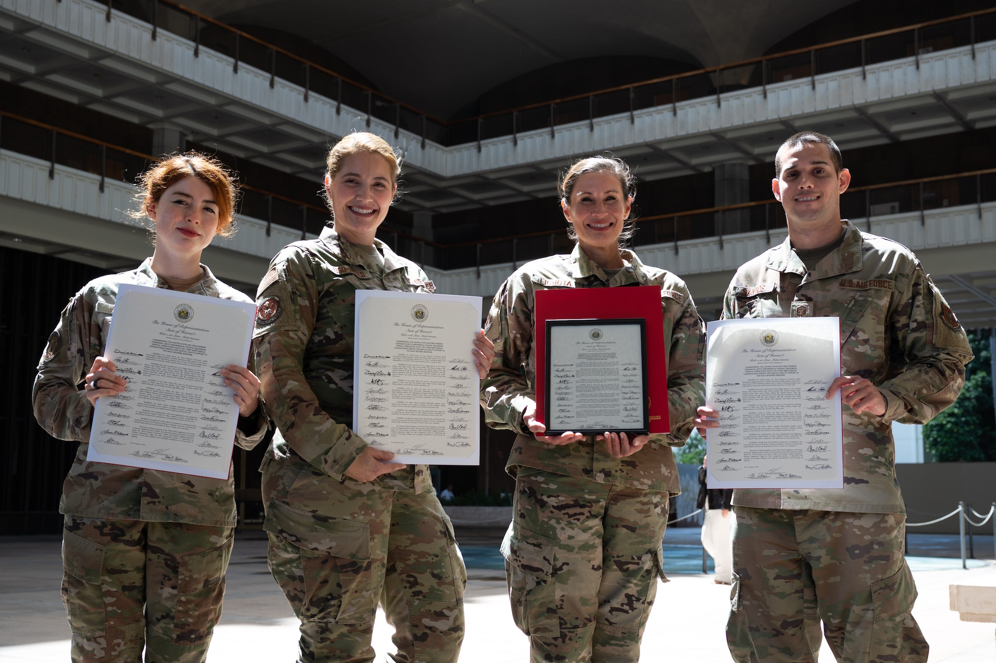 Members of the 624th Aeromedical Staging Squadron receive the Impact Award at the Hawaii State Capitol, March 7, 2025