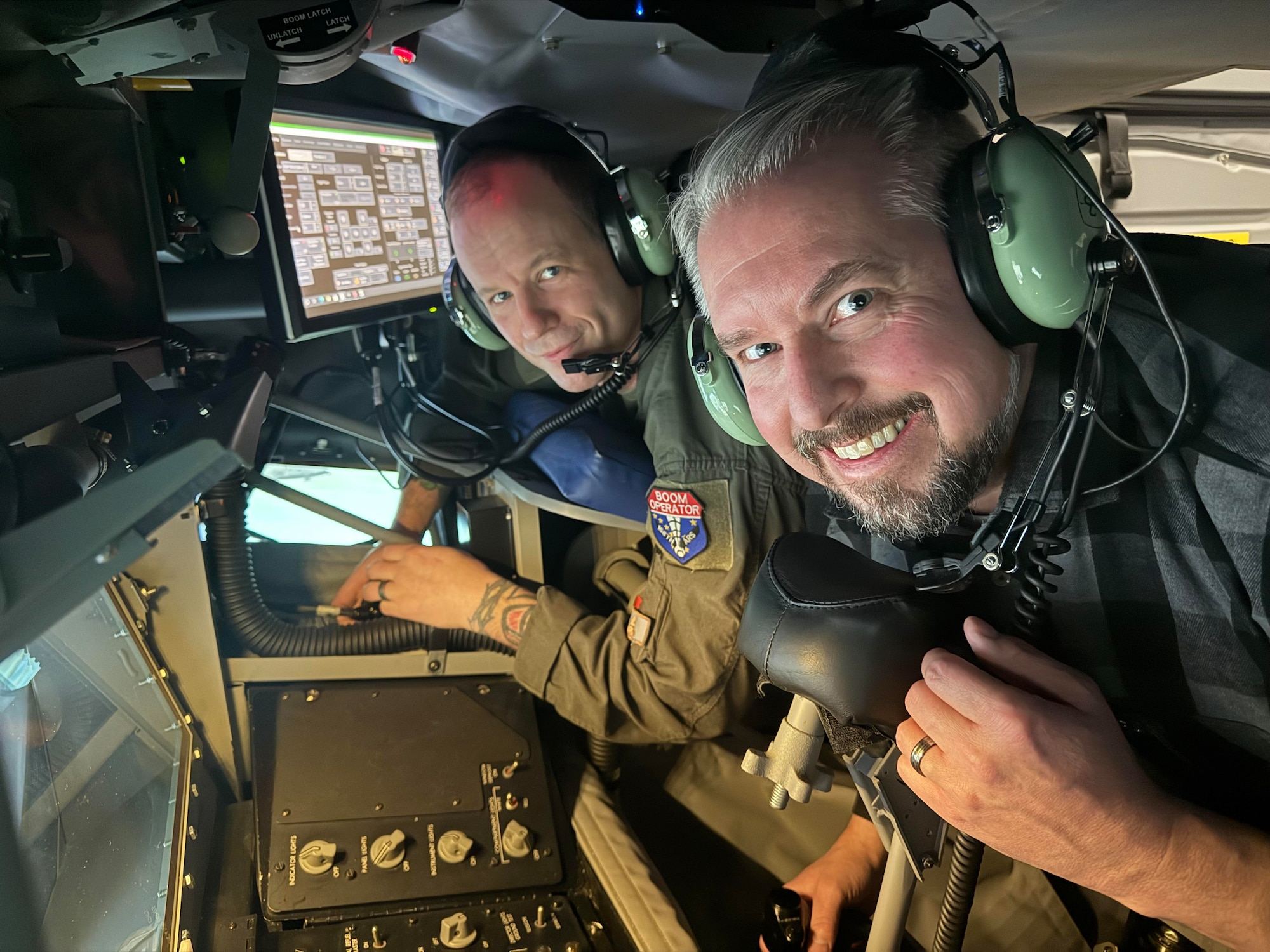 North Pole Mayor Larry Terch experiences air refueling operations with Master Sgt. Pete Gardella, 168th Wing boom operator, as his instructor on the air KC-135 air refueling simulator