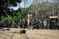 U.S. Army Pfc. Bernardo Gurrola, a radio telephone operator with the 1st Battalion, 3rd Field Artillery Regiment, 17th Field Artillery Brigade, simulates a communications tower setup for the Royal Thai Army during Hanuman Guardian 25 in Lop Buri, Thailand on March 13, 2025.
