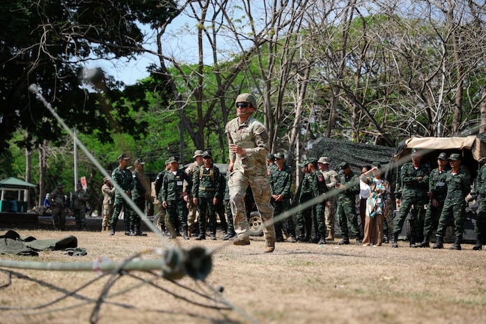 U.S. Army Pfc. Bernardo Gurrola, a radio telephone operator with the 1st Battalion, 3rd Field Artillery Regiment, 17th Field Artillery Brigade, simulates a communications tower setup for the Royal Thai Army during Hanuman Guardian 25 in Lop Buri, Thailand on March 13, 2025.