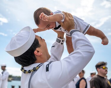Joint Base Pearl Harbor-Hickam, Hawaii, March 16, 2025. Machinist's Mate, Nuclear Power, 2nd Class Chris Gailiatabarez plays with his son after the Virginia-class fast-attack submarine USS Vermont (SSN 792) returned to Joint Base Pearl Harbor-Hickam, Hawaii following a scheduled deployment, March 16, 2025. Vermont is the third U.S. Navy ship named after the Green Mountain State.