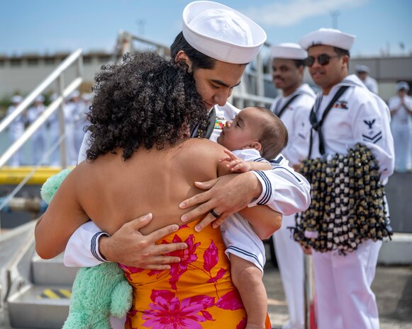 Joint Base Pearl Harbor-Hickam, Hawaii, March 16, 2025. Machinist's Mate, Nuclear Power, 2nd Class Chris Gailiatabarez greets his family after the Virginia-class fast-attack submarine USS Vermont (SSN 792) returned to Joint Base Pearl Harbor-Hickam, Hawaii following a scheduled deployment, March 16, 2025. Vermont is the third U.S. Navy ship named after the Green Mountain State.