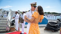 Joint Base Pearl Harbor-Hickam, Hawaii, March 16, 2025 – Lt. Erich Eden greets his girlfriend after the Virginia-class fast-attack submarine USS Vermont (SSN 792) returned to Joint Base Pearl Harbor-Hickam, Hawaii following a scheduled deployment, March 16, 2025.