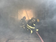 U.S. Army Garrison firefighters extinguish flames after a controlled burn exercise at Torii Station, Okinawa, Japan, March 17, 2025.
