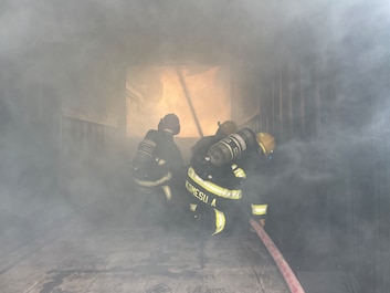 OKINAWA, Japan (March 17, 2025) — U.S. Army Garrison firefighters extinguish flames after a controlled burn exercise at Torii Station, Okinawa, Japan, March 17, 2025. The training teaches firefighters to recognize, prevent and survive a flashover, a dangerous, rapid ignition of gases that can occur in a fire.