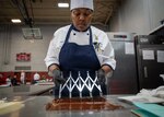 FORT GREGG-ADAMS, Va. – Culinary Specialist 1st Class Jasmine Reynolds competes in the Pastry Chef of the Year event as part of team U.S. Navy during the 49th Joint Culinary Training Exercise (JCTE) held at Fort Gregg-Adams, Virginia, March 4th, 2025. The JCTE is an annual event showcasing culinary talent across all components of the Department of Defense and is the largest American Culinary Federation-sanctioned competition in North America. (U.S. Navy photo by Brett Dodge)