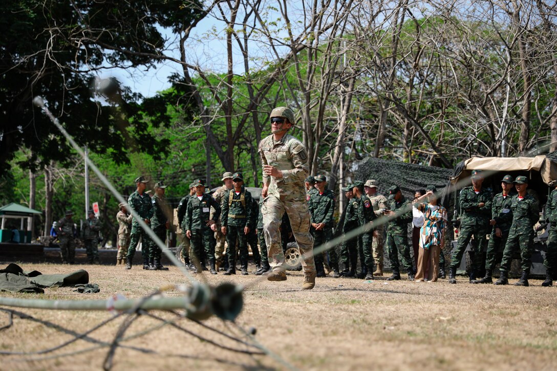 U.S. Army Pfc. Bernardo Gurrola, a radio telephone operator with the 1st Battalion, 3rd Field Artillery Regiment, 17th Field Artillery Brigade, simulates a communications tower setup for the Royal Thai Army during Hanuman Guardian 25 in Lop Buri, Thailand on March 13, 2025.