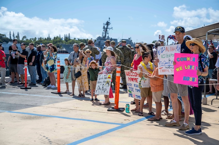 Joint Base Pearl Harbor-Hickam, Hawaii, March 16, 2025 – Friends and family of Sailors assigned to the Virginia-class fast-attack submarine USS Vermont (SSN 792) watch as the submarine returns to Joint Base Pearl Harbor-Hickam, Hawaii after a scheduled deployment, March 16, 2025.