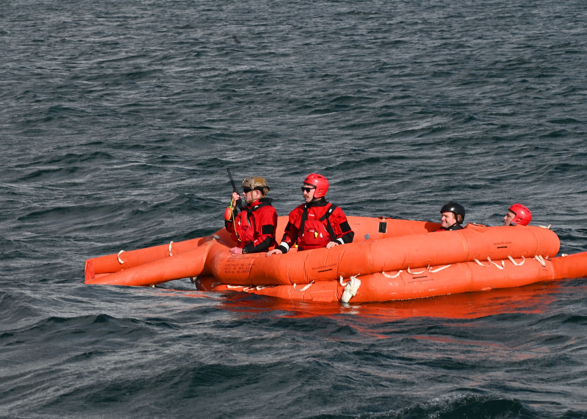 U.S. Airmen stationed at Fairchild Air Force Base, Washington, wait for extraction during Exercise Bamboo Eagle 25-1, in San Diego Bay, California, on Feb. 14, 2025. The 414th Combat Training Squadron Detachment 1 designed the scenario to train against the toughest threats the force might face, with readiness and the goal of continuous improvement as an everyday priority. (U.S. Air Force photo by Staff Sgt. Abbey Rieves)