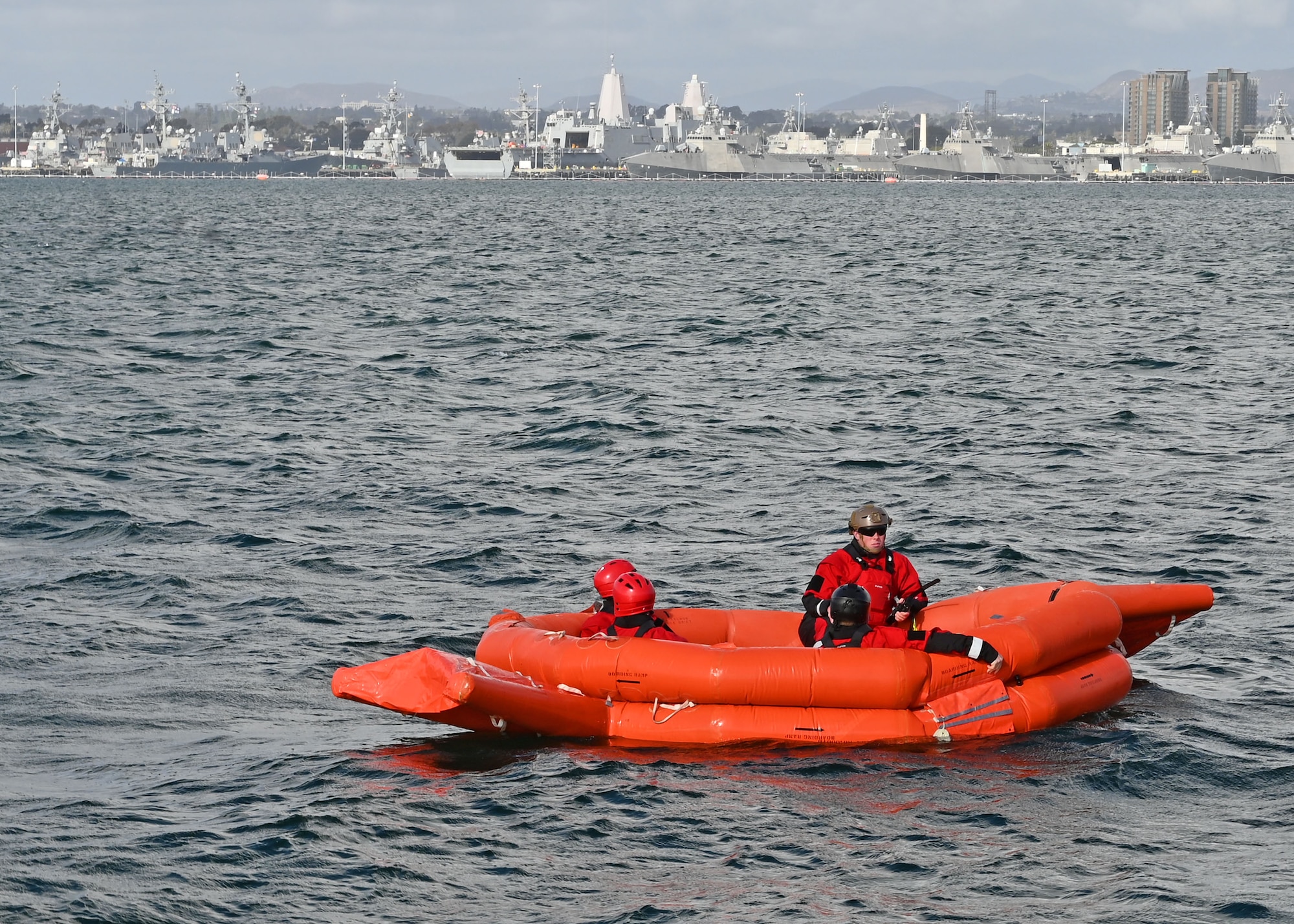 U.S. Airmen assigned to Fairchild Air Force Base, Washington, call for extraction during Exercise Bamboo Eagle 25-1, in the San Diego Bay, California, Feb. 14, 2025. The Airmen were scenario actors who survived a simulated aircraft crash in open water. BE demonstrated the U.S. Air Force’s ability to operate in a contested, dynamic environment against high-end threats on short notice. (U.S. Air Force photo by Staff Sgt. Abbey Rieves)
