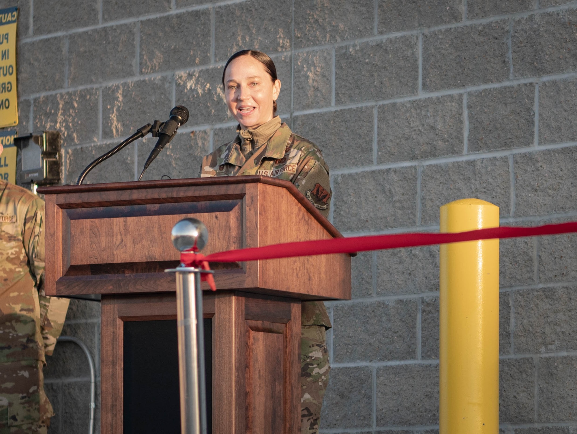 Lt. Col. Caitlin Oviatt, 55th Logistics Readiness Squadron commander, provides remarks during a ribbon cutting ceremony for the new LRS campus March 14, 2025. More than 50 Airmen, civilians, and leaders attended the event. (U.S. Air Force photo by Daniel Martinez)