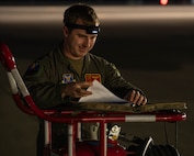 U.S. Air Force Capt. Hudson Walberg, 23rd Bomb Squadron pilot, conducts pre-flight procedures during Red Flag 25-2 at Nellis Air Force Base, Nevada, March 11, 2025. Exercises like Red Flag help warfighters to develop the right operational concepts, capabilities, and plans to bolster deterrence and maintain the competitive advantage against any adversary. (U.S. Air Force photo by Senior Airman Kyle Wilson)