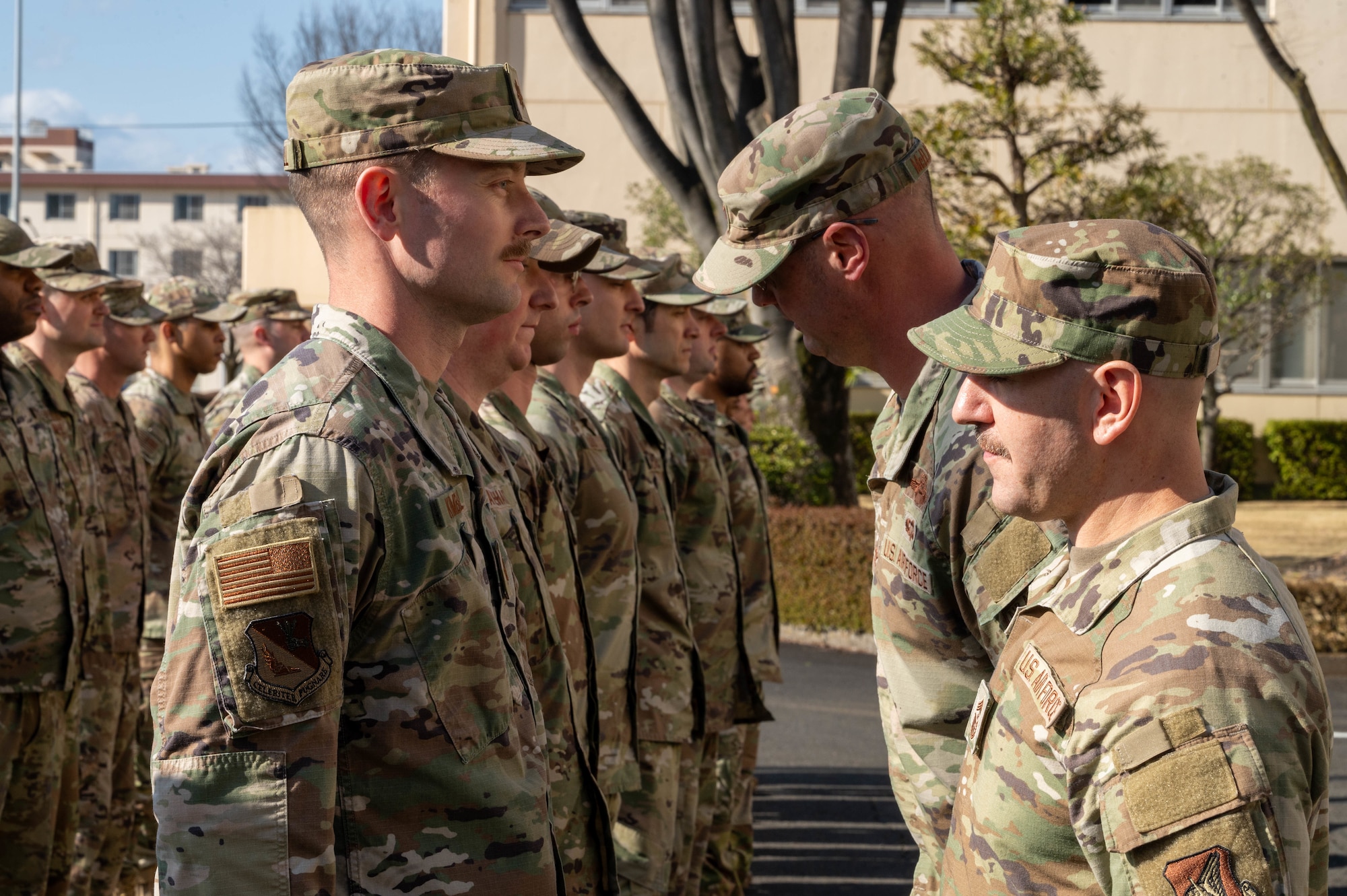 374th Airlift Wing commander and command chief inspects Airmen’s uniforms.