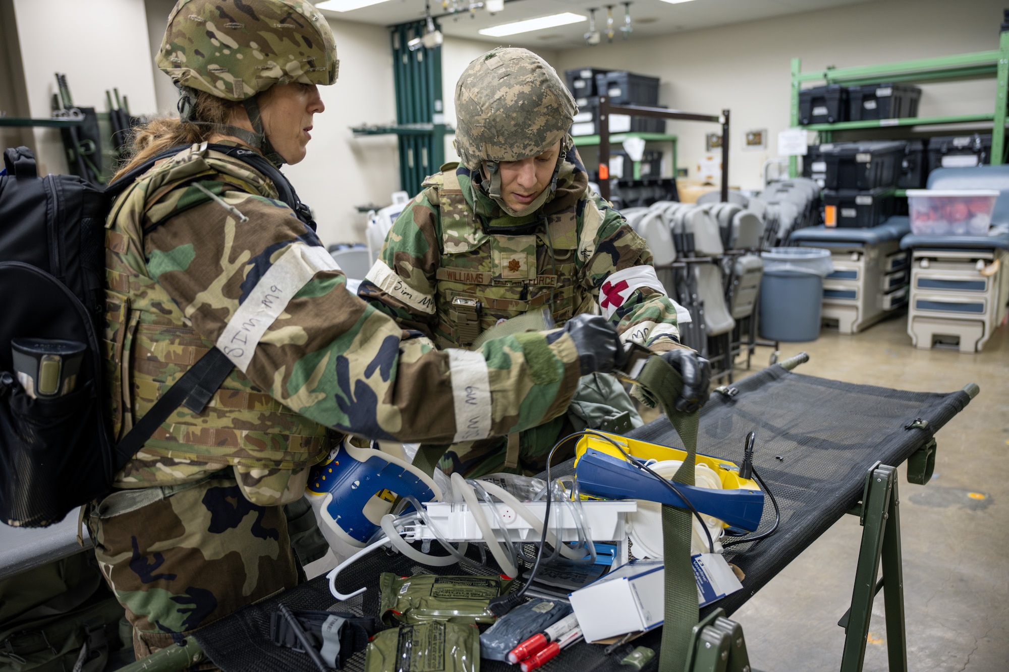 U.S. Air Force personnel assigned to the 35th Medical Group prepares equipment for a simulated medical evacuation during Beverly Sunrise 25-03 at Misawa Air Base, Japan, March 17, 2025. This exercise scenario tested the ability of medical personnel to rapidly respond, coordinate patient transport, and provide critical care in a simulated contingency scenario, ensuring readiness for real-world emergencies. (U.S. Air Force photo by Senior Airman William Rodriguez)