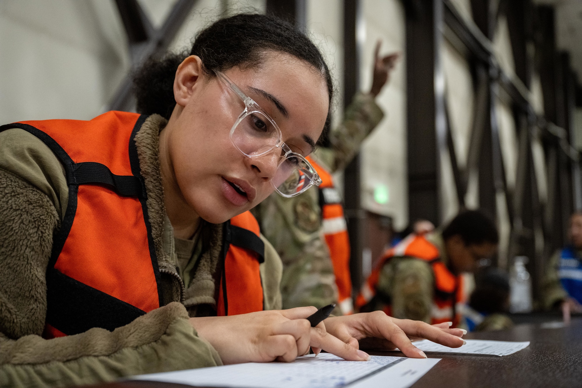 Airman performs a personnel accountability check