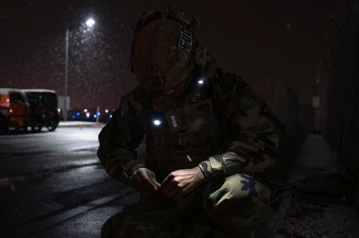 A U.S. Air Force Airman assigned to the 35th Civil Engineer Squadron explosive ordnance disposal flight prepares a detonation cord to neutralize a simulated drone during Beverly Sunrise 25-03 at Misawa Air Base, Japan, March 18, 2025. This exercise reinforces operational readiness, enhancing the 35th Fighter Wing's ability to respond to emerging threats and ensuring Airmen are mission-ready in contested environments. (U.S. Air Force photo by Senior Airman Brittany Russell)