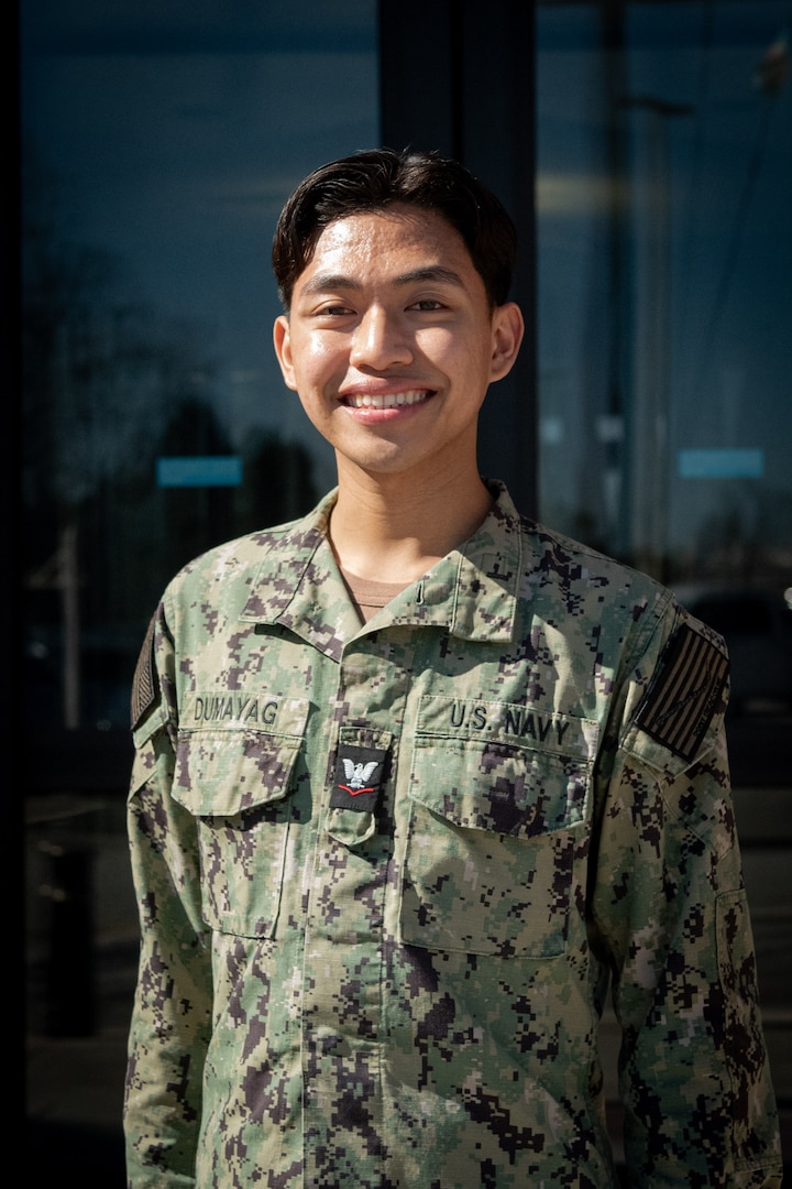 Hospital Corpsman Third Class Marc Philip Dumayag supports families and uplifts staff members as a General Duty Corpsman at Naval Health Clinic Cherry Point, aiming to leverage his experience as a Corpsman to become a pediatrician.