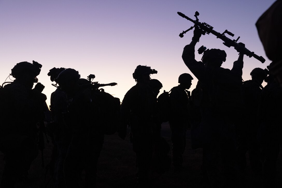 U.S. Marines with Weapons Company, Battalion Landing Team, 3rd Battalion, 6th Marine Regiment, 22nd Marine Expeditionary Unit, prepare to board an MV-22B Osprey with Marine Medium Tiltrotor Squadron 263 (Reinforced), 22nd MEU, during a simulated Tactical Recovery of Aircraft and Personnel mission as part of Realistic Urban Training (RUT) Exercise on Fort Barfoot, Virginia, March 17, 2025. RUT is a land-based training exercise which enables the 22nd MEU to conduct expeditionary operations as a cohesive Marine Air-Ground Task Force, in preparation to integrate with U.S. Navy for future operations. (U.S. Marine Corps photo by Sgt. Nathan Mitchell)