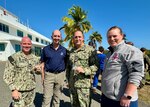 GUANTANAMO BAY, Cuba (Feb. 27, 2025) – From left, U.S. Navy Cmdr. Chris Johnson, director of public health at U.S. Naval Hospital Guantanamo Bay; Dr. Stephen Ferrara, Acting Assistant Secretary of Defense for Health Affairs; U.S. Navy Senior Chief Hospital Corpsman Michael Hart; and U.S. Navy Cmdr. Christa Robinson, director of medical services at U.S. Naval Hospital Guantanamo Bay, are recognized for their outstanding work and leadership in support of Joint Task Force Southern Guard. Johnson, Hart, and Robinson played an integral role in ensuring safe health conditions and medical planning for the task force. (U.S. Navy photo by Emily McCamy)