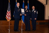 SERVICEMEMBERS POSE FOR A PHOTO