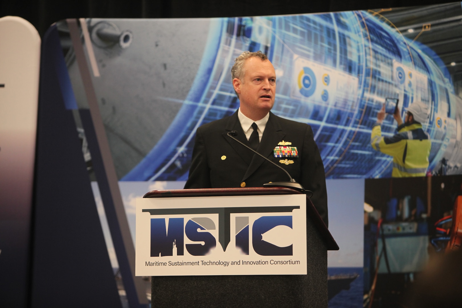 Capt. Joseph Darcy, Commanding Officer, Naval Surface Warfare Center Philadelphia Division (NSWCPD) gives keynote address during the Maritime Sustainment Technology and Innovation Consortium (MSTIC) MSTIC-25-02 Collaboration Event at the Philadelphia Convention Center on March 12-13, 2025. The goal was to build awareness of the broad array of opportunities and open collaboration between the Government and technology innovators from the defense industrial base. (U.S. Navy Photo by Gary Ell/Released)