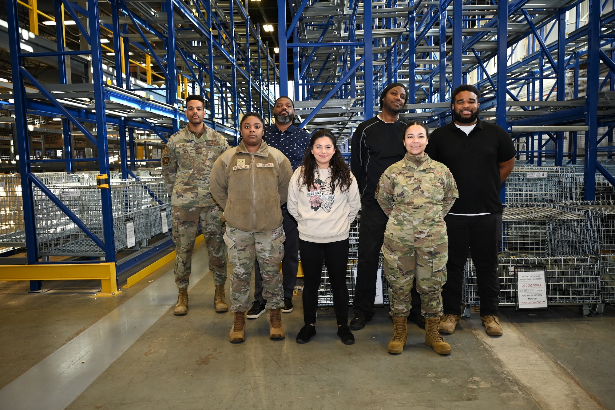 U.S. Air Force service members and logistical support members assigned to the integrated personnel equipment section of the 11th Logistics Readiness Squadron gather for a photo in Hangar 1 at Joint Base Anacostia-Bolling in Washington, D.C., March 18, 2025. This team spearheaded the opening of the base’s first deployment armory which furthers JBAB’s mission readiness. (U.S. Air Force Photo by Airman 1st Class Shanel Toussaint)