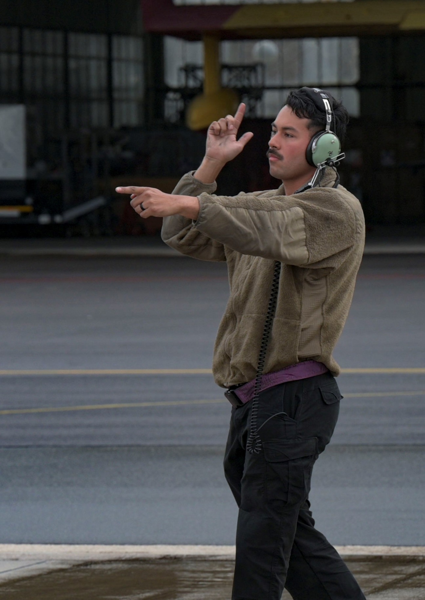 man directing aircraft