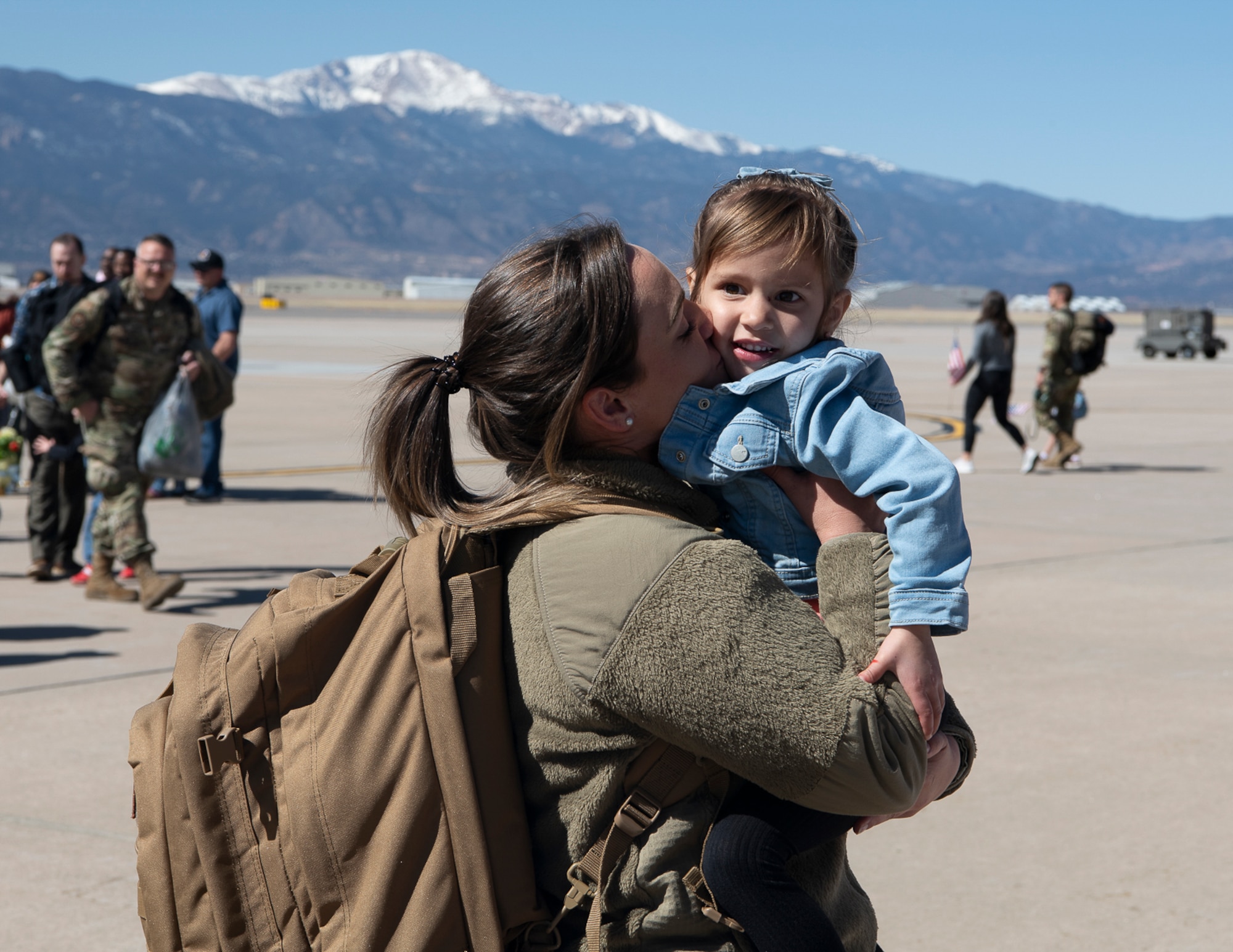 A woman hugging her child.