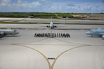 250313-N-ER662-0384 ANDERSEN AIR FORCE BASE, Guam (March 13, 2025) Participants from the Royal Australian Air Force (RAAF), Indian Navy, Japan Maritime Self-Defense Force(JMSDF), Republic of Korea Navy(ROKN), and the United States Navy pose for a group photo alongside a ROKN P-3 Orion (left), RAAF P-8A Poseidon (center), and JMSDF Kawasaki P-1 (right) during Exercise Sea Dragon 2025 at Andersen Air Force Base , Guam, March 13, 2025. Sea Dragon 2025 is a U.S.-led, multinational exercise designed to teach and practice anti-submarine warfare tactics, build proficiency and prepare participants for high-end ASW operations within the Indo-Pacific region. (U.S. Navy photo by Chief Mass Communication Specialist Matthew Cole).
