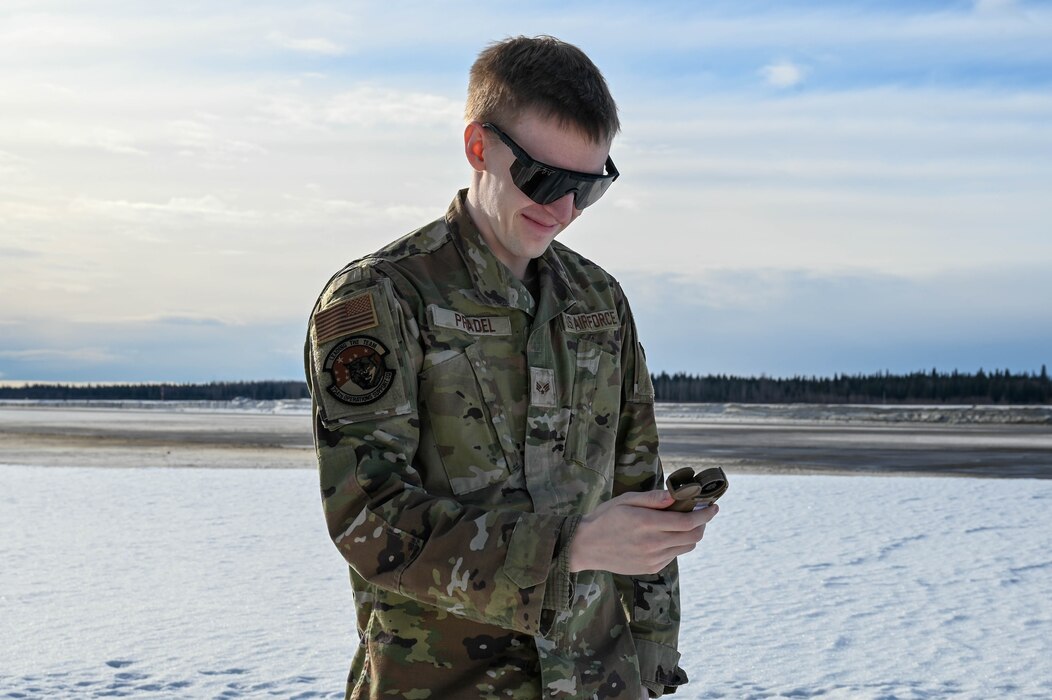 U.S. Air Force Senior Airman Jered Pradel, 354th Operation Support Squadron weather forecaster, conducts atmospheric readings at Eielson Air Force Base, Alaska, March 6, 2025.