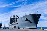 USNS John Lewis (T-AO 205) sits pierside at Naval Surface Warfare Center, Port Hueneme Division (NSWC PHD), Friday, Nov. 4. The U.S. Navy fleet replenishment oiler, delivered to Military Sealift Command in July, is in the beginning months of its year-long ship qualification trials schedule and stopped by NSWC PHD for a stores resupply and minor repairs by builder representatives. The Underway Replenishment (UNREP) fuel and cargo delivery stations aboard the civilian-crewed ship use the new Electric Standard Tensioned Replenishment Alongside Method (E-STREAM) technology, designed by NSWC PHD UNREP engineers. USNS John Lewis is the first oiler to have the new E-STREAM systems on board, and the command’s UNREP team members were excited to see in person the system installed on a ship. (U.S. Navy photo by Dana Rene White/Released)