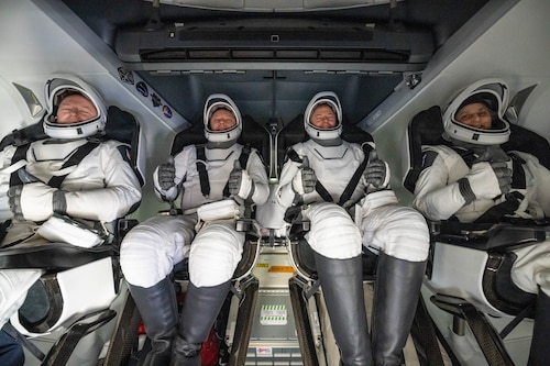 An astronaut lands in the water.
