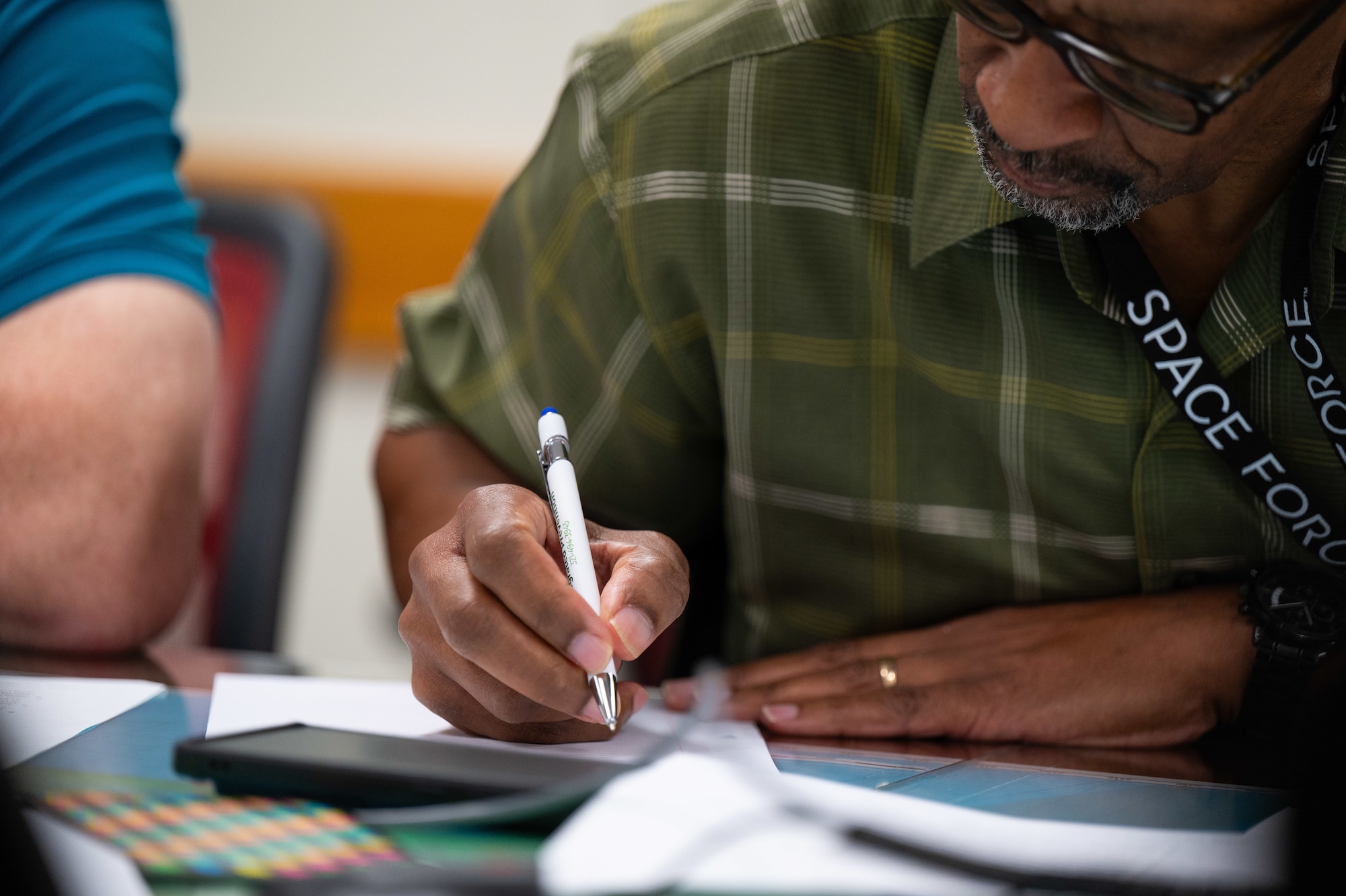 Volunteers write letters to veterans during the first Voice the Unspoken event at Patrick Space Force Base, Florida, Jan. 30, 2025. Voice the Unspoken is a Space Launch Delta 45 Integrated Primary Prevention Workforce initiative that brings volunteers together to handwrite messages to veterans.  These letters provide inspiration and make a meaningful impact on the lives of veterans in crisis, offering hope, support, and a sense of connection. (U.S. Space Force photo by Amanda Inman)