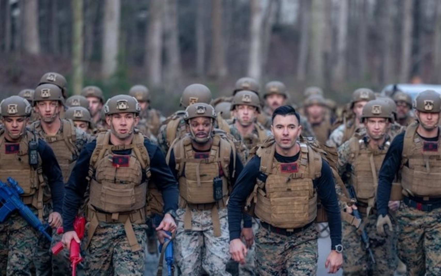 U.S. Marines with Martial Arts Instructor Trainer Course 1-24 conduct movement to a training site located at The Basic School on Marine Corps Base Quantico, Virginia, March, 29, 2024. The exercise consisted of sparring, casualty evacuation, and oleoresin capsicum spray training. (U.S. Marine Corps photo by Lance Cpl. Ethan Miller)