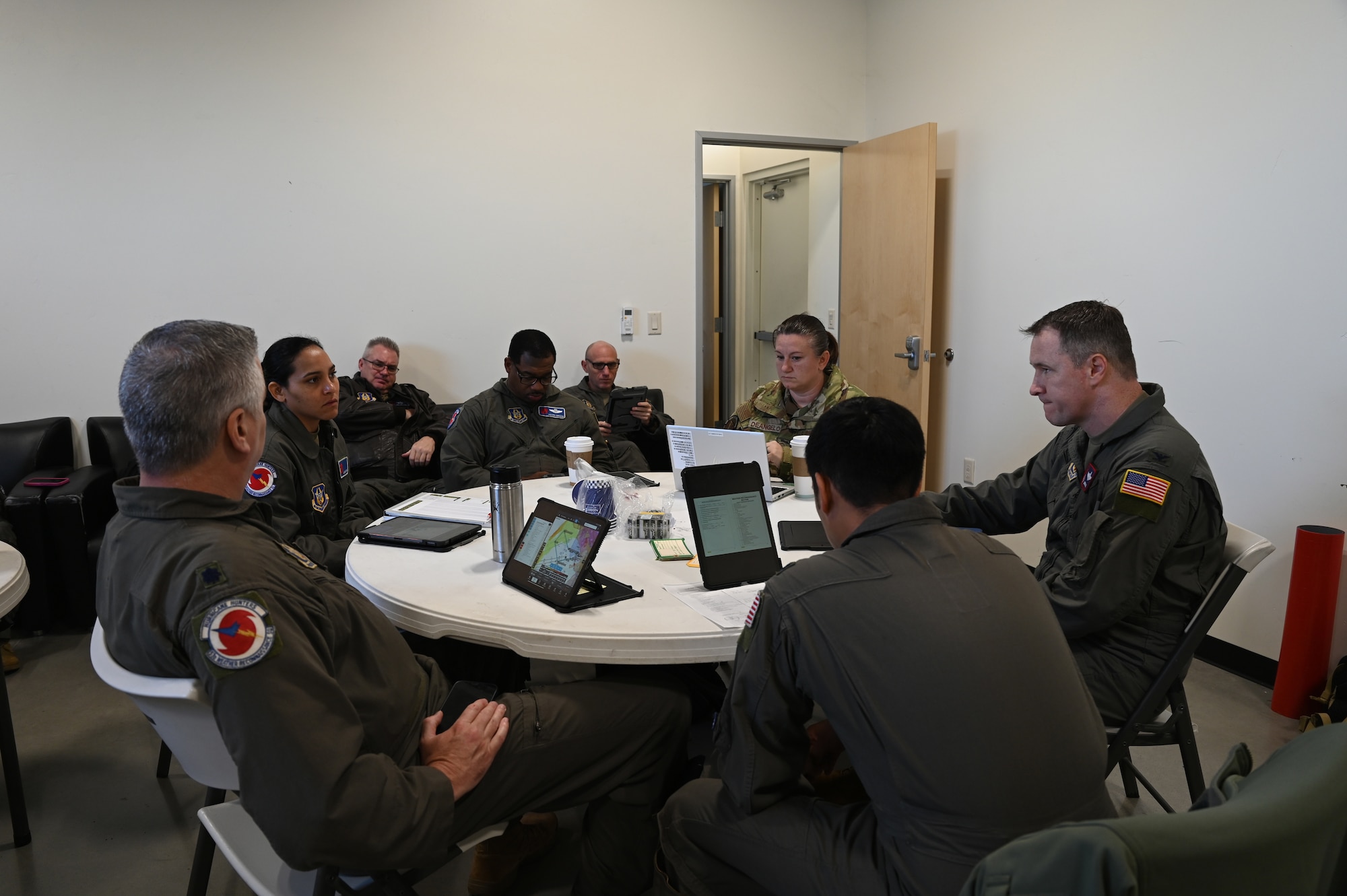 Weather Airman briefs aircrew during a pre-flight briefing.