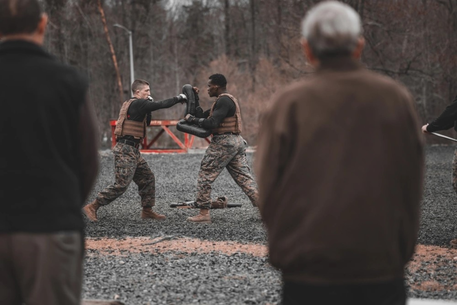 U.S. Marine Corps Gunnery Sgt. Jack Pavao, martial arts instructor trainer, and Sgt. Ar’kel Brown, martial arts instructor trainer, conduct a Marine Corps Martial Arts Demonstration at The Basic School on Marine Corps Base Quantico, Virginia, March 14, 2025. The Marine Corps Martial Arts Program aims to enhance Marines' warfighting capabilities, boost self-confidence, esprit de corps, and foster a warrior ethos, focusing on physical, mental, and moral resilience. (U.S. Marine Corps photo by Lance Cpl. Ethan Miller)