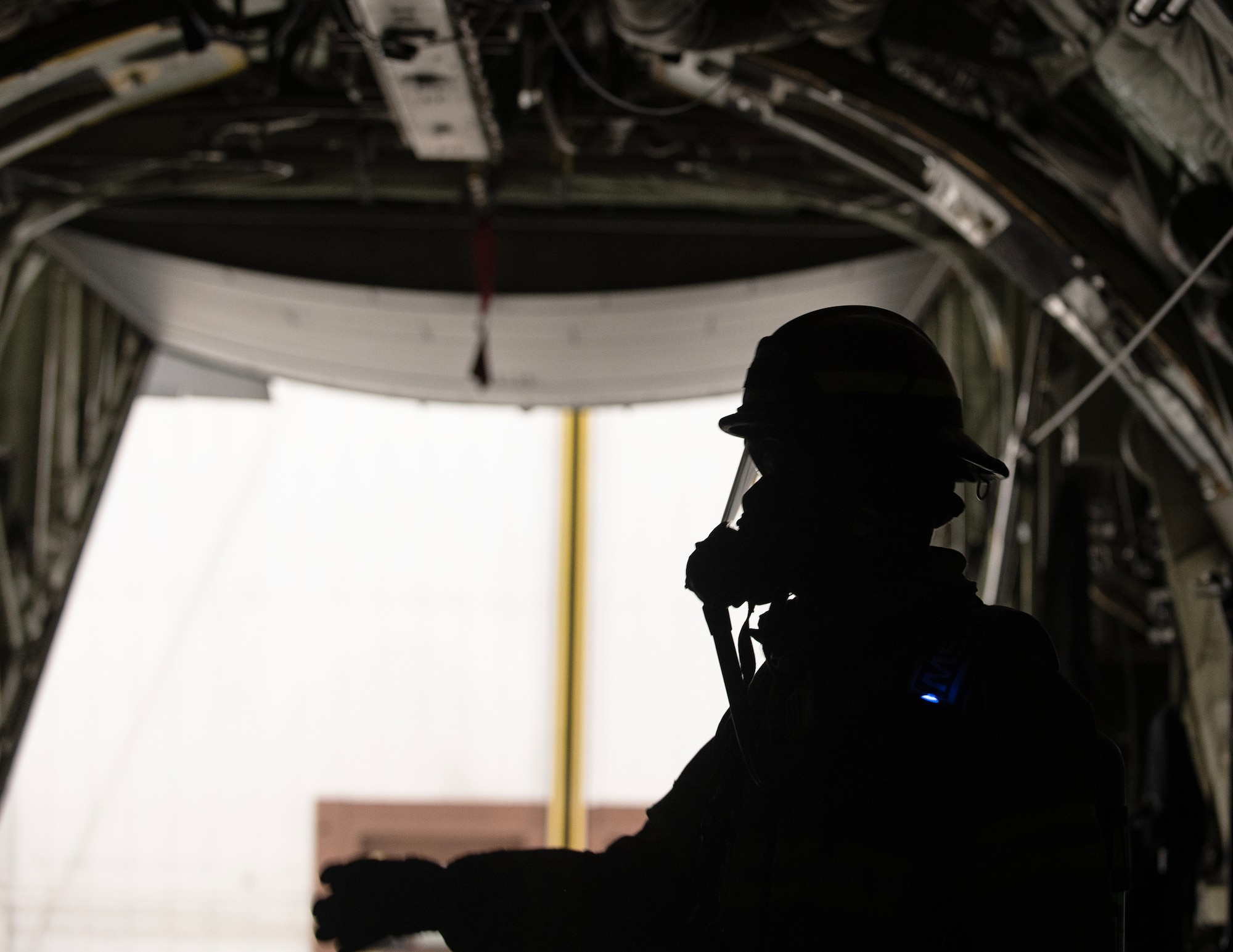 Service members from the 133rd and 934th Airlift Wings, 55th Civil Support Team, and firefighters from the Minneapolis–Saint Paul International Airport’s Fire Department respond to a simulated suspicious package on a C-130 Hercules in St. Paul, Minn., Jan. 31, 2025.