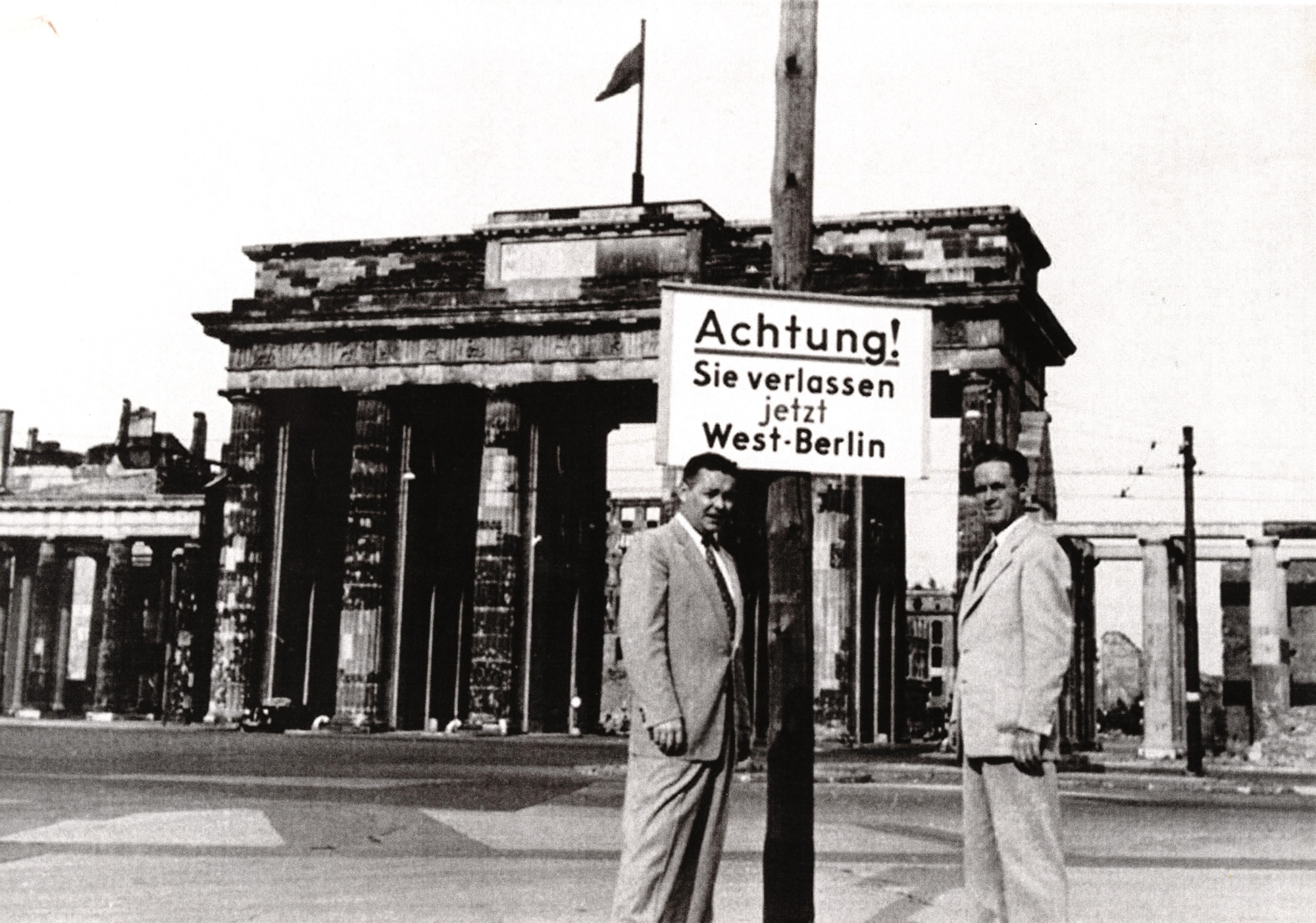 Brigadier General John E. Murray (left), Director of AFOSI USAFE, and Major General Joseph F. Carroll (right), AFOSI Commander, in front of the Brandenburg Gate in West Berlin in the early 1950s