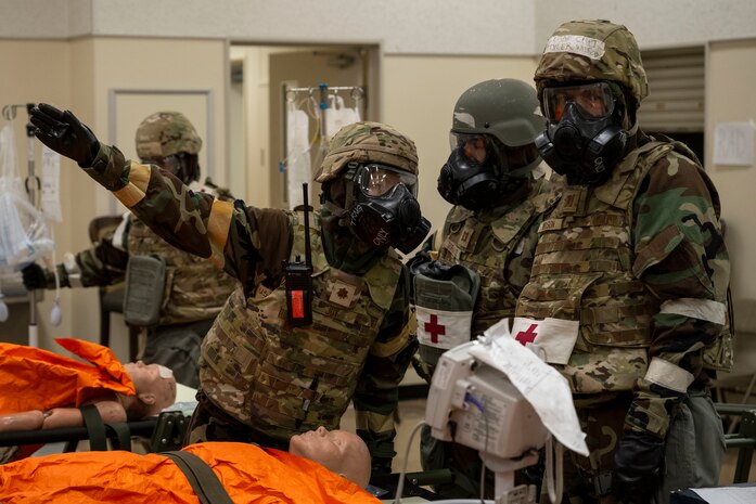 U.S. Air Force Maj. Brandy Joy, left, 35th Medical Group (MDG) emergency services flight commander, directs Capt. Javier Borrayo, center, 35th MDG behavioral health prrovider, and Capt. Tyler Wilson, internal medicine physician during during Beverly Sunrise 25-03.
