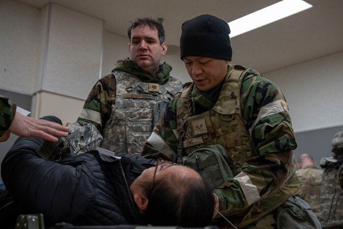 U.S. Air Force Senior Airman Andrew Long, 35th Medical Group pediatric medical technician, simulates treating a casualty actor during Beverly Sunrise 25-03.