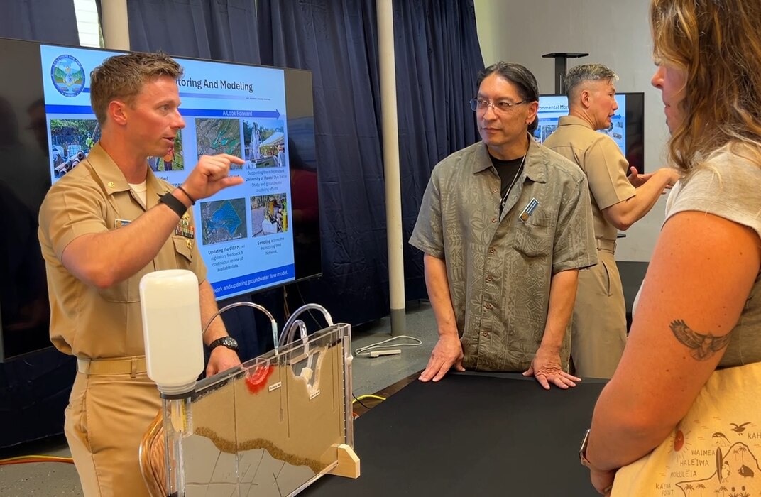 HONOLULU (March 12, 2025) Navy Closure Task Force-Red Hill (NCTF-RH) subject matter experts speak with guests at an interactive groundwater monitoring display during the NCTF-RH open house held at the Keʻehi Lagoon Memorial in Honolulu, March 12, 2025. NCTF-RH hosted the open house for members of the community to learn more about current and future efforts of the Red Hill Bulk Fuel Storage Facility (RHBFSF) closure, tank cleaning, and drinking water monitoring.  Charged with the safe decommissioning of the facility, NCTF-RH was established by the Department of the Navy as a commitment to the community and the environment, and continues to engage with the people of Hawaii, regulatory agencies, and other stakeholders as it safely and deliberately decommissions the RHBFSF. (U.S. Navy photo by Mass Communication Specialist First Class Glenn Slaughter)