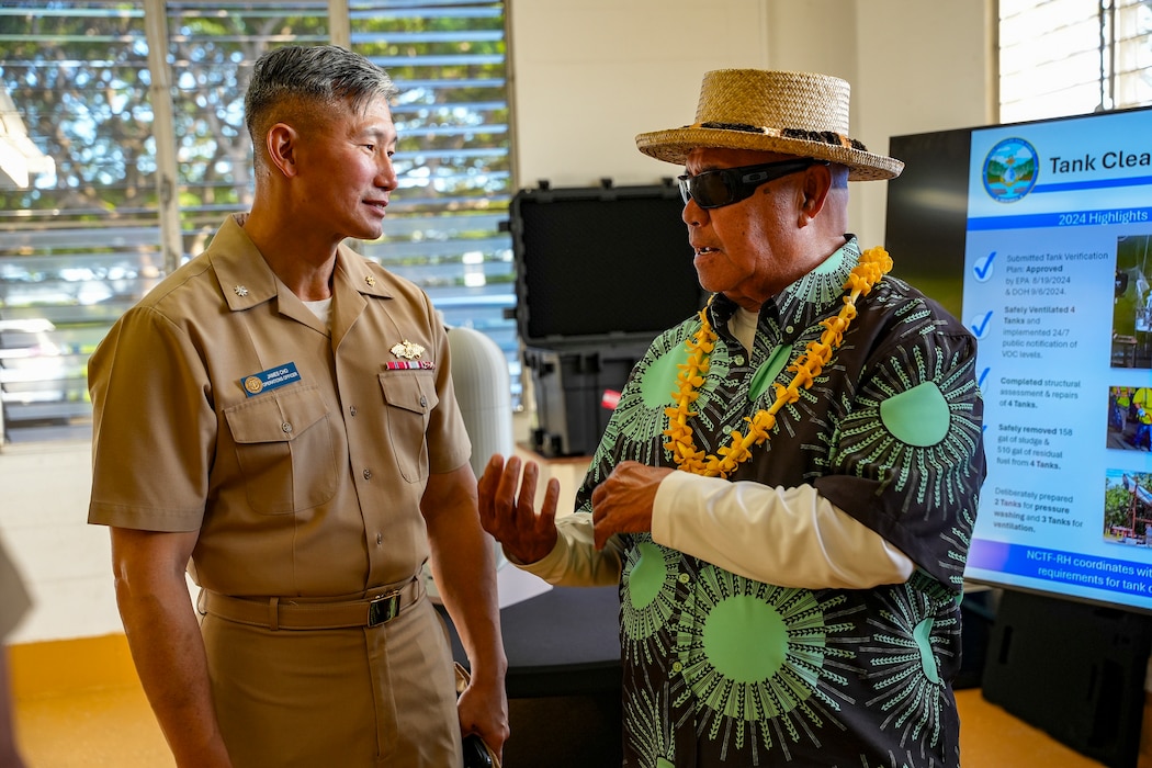 HONOLULU (March 12, 2025) The Navy Closure Task Force-Red Hill (NCTF-RH) operations director speaks with Uncle Kalani Whitford, a community “Kupuna,” or elder, during the NCTF-RH open house held at the Keʻehi Lagoon Memorial in Honolulu, March 12, 2025. NCTF-RH hosted the open house for members of the community to learn more about current and future efforts of the Red Hill Bulk Fuel Storage Facility (RHBFSF) closure, tank cleaning, and drinking water monitoring.  Charged with the safe decommissioning of the facility, NCTF-RH was established by the Department of the Navy as a commitment to the community and the environment, and continues to engage with the people of Hawaii, regulatory agencies, and other stakeholders as it safely and deliberately decommissions the RHBFSF. (U.S. Navy photo by Mass Communication Specialist Seaman Krystal Diaz)
