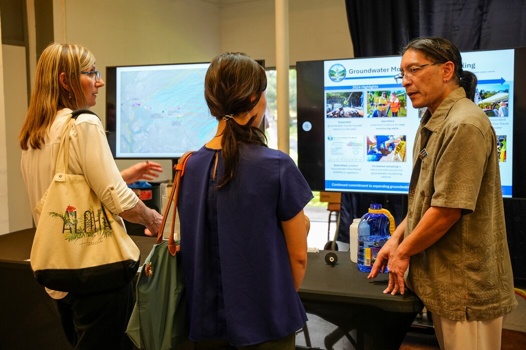 HONOLULU (March 12, 2025) A Navy Closure Task Force-Red Hill (NCTF-RH) subject matter expert, right, speaks with guests during the NCTF-RH open house held at the Keʻehi Lagoon Memorial in Honolulu, March 12, 2025. NCTF-RH hosted the open house for members of the community to learn more about current and future efforts of the Red Hill Bulk Fuel Storage Facility (RHBFSF) closure, tank cleaning, and drinking water monitoring.  Charged with the safe decommissioning of the facility, NCTF-RH was established by the Department of the Navy as a commitment to the community and the environment, and continues to engage with the people of Hawaii, regulatory agencies, and other stakeholders as it safely and deliberately decommissions the RHBFSF. (U.S. Navy photo by Mass Communication Specialist Seaman Krystal Diaz)