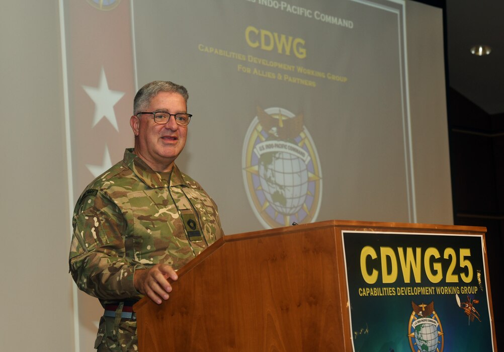 British Commodore Jonathan Lett, the Director of J-5 Policy for U.S. Indo-Pacific Command, delivers the opening remarks at the Capabilities Development Working Group (SDWG) 2025.