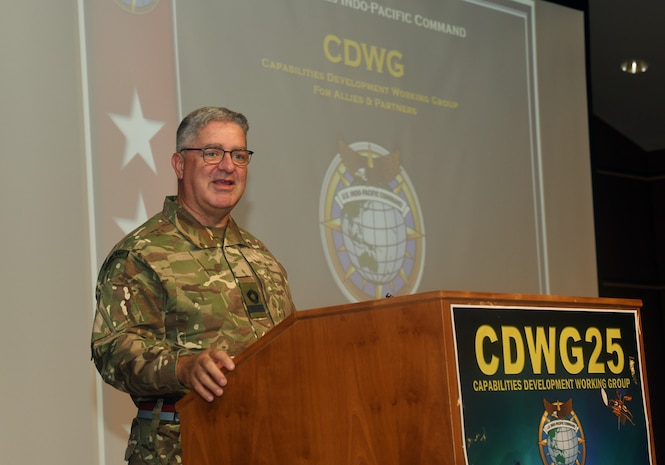 British Commodore Jonathan Lett, the Director of J-5 Policy for U.S. Indo-Pacific Command, delivers the opening remarks at the Capabilities Development Working Group (SDWG) 2025.