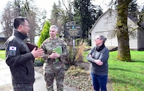 Brig. Gen. Kyoung-suk Woo, Republic of Korea Ministry of Defense, along with Oregon Army National Guard Lt. Col. Christopher Markesino, Director of Oregon State Partnership Program, and Katrina O'Brien, Director of Programs & Services for the Oregon Military Museum, pause for a discussion following a tour of the museum on March 4, 2025 at Camp Withycombe in Happy Valley, Oregon.