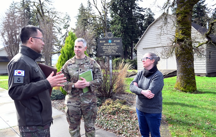 Brig. Gen. Kyoung-suk Woo, Republic of Korea Ministry of Defense, along with Oregon Army National Guard Lt. Col. Christopher Markesino, Director of Oregon State Partnership Program, and Katrina O'Brien, Director of Programs & Services for the Oregon Military Museum, pause for a discussion following a tour of the museum on March 4, 2025 at Camp Withycombe in Happy Valley, Oregon.