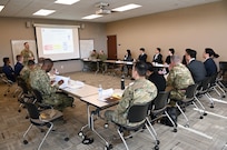 U.S. Air Force Lt. Col. Griff Hofman leads a discussion during a bilateral working session on March 5, 2025 at Camp Withycombe in Happy Valley, Oregon.