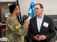 U.S. Air Force Lt. Col. Jonathan Rydberg and Scott Moore have a discussion during U.S. Indo-Pacific Command’s Capabilities Development Working Group at the Camp Withycombe Armed Forces Readiness Center in Happy Valley, Oregon on March 5, 2025.